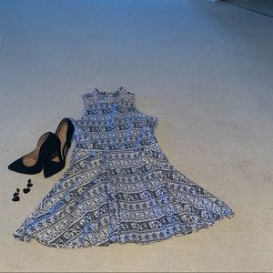 Black and white sleeveless skater dress.